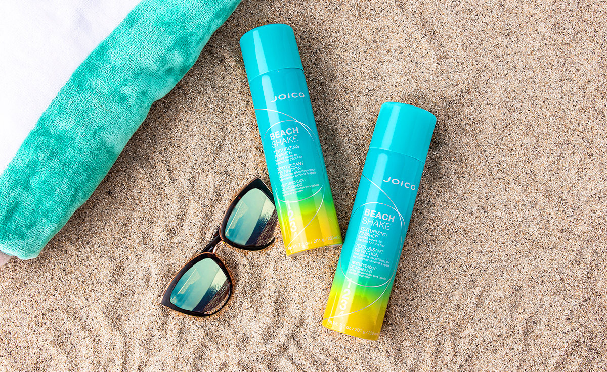 beach-shake-styled Joico beach shake bottles in sand