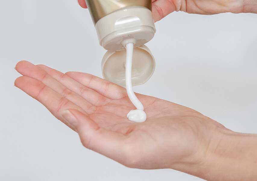 Blonde Life Masque being poured into hand