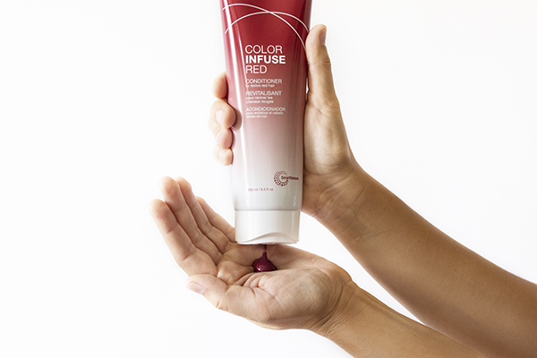 Joico Color Infuse Red Conditioner in hand