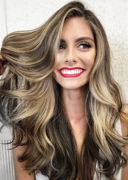 Larisa Love hair model showing freshly colored demensioal brunette hair