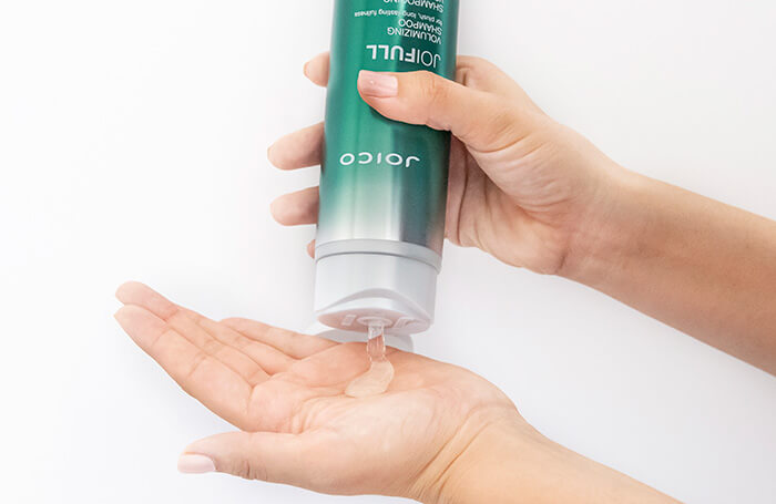 JoiFull Volumizing Shampoo being poured into hand