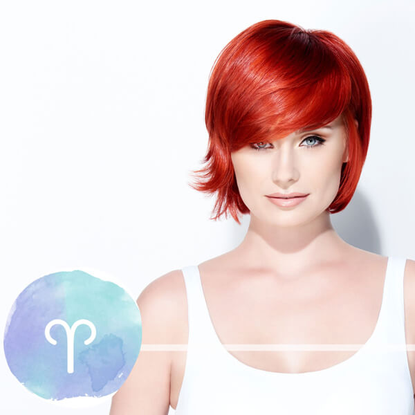 aries-horoscope-model Model with vibrant red hair and a short bob haircut