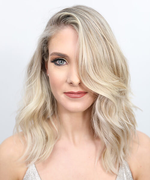 Blonde women showing hair after being colored