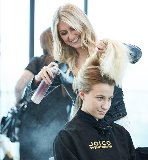 Hair dresser prepping hair