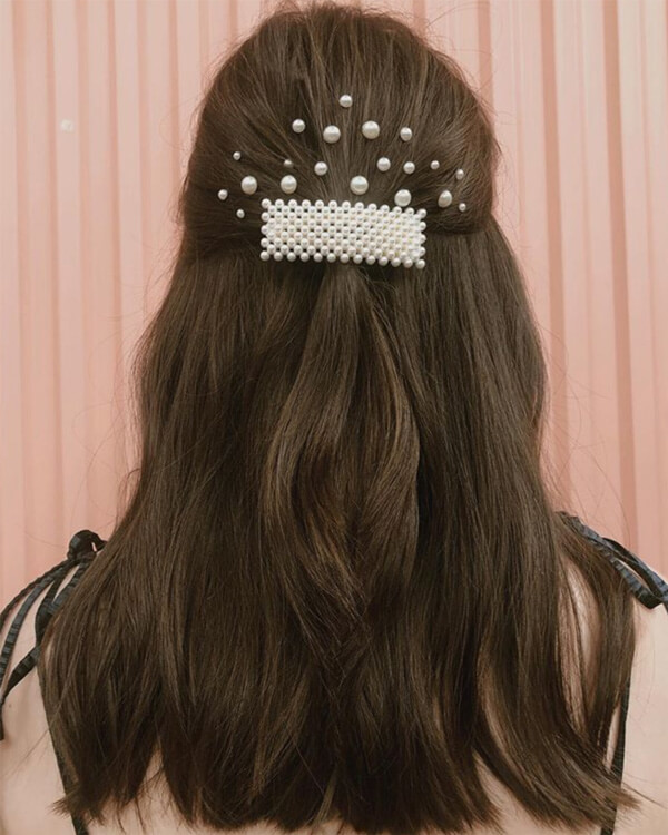 clips-in-hair Brunette with pearl barret in hair