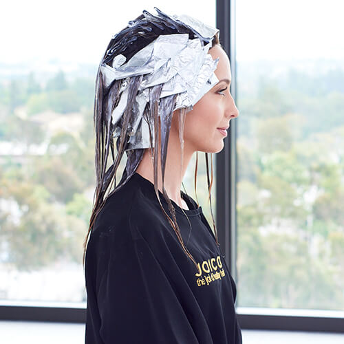 Womens hair in foils for hair coloring