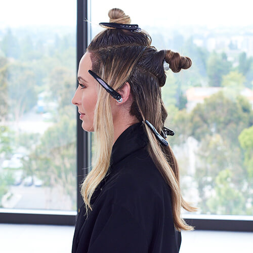 Womens hair parted into sections