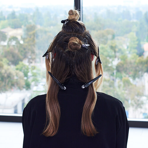 Womens hair parted into sections