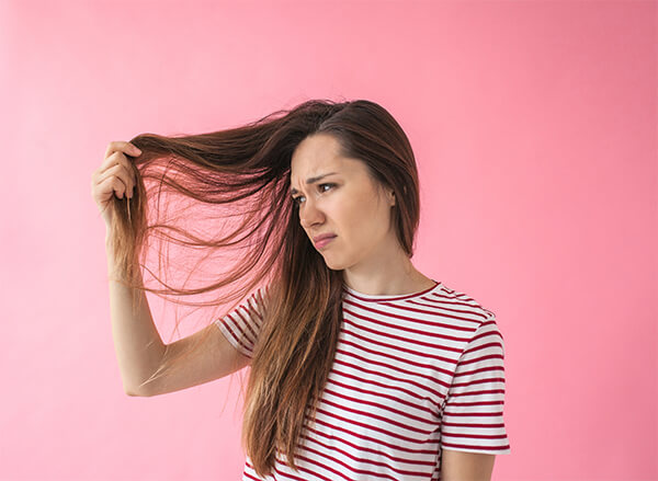 Women looking at tangled hair