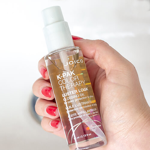 k pak color therapy glossing oil in hand