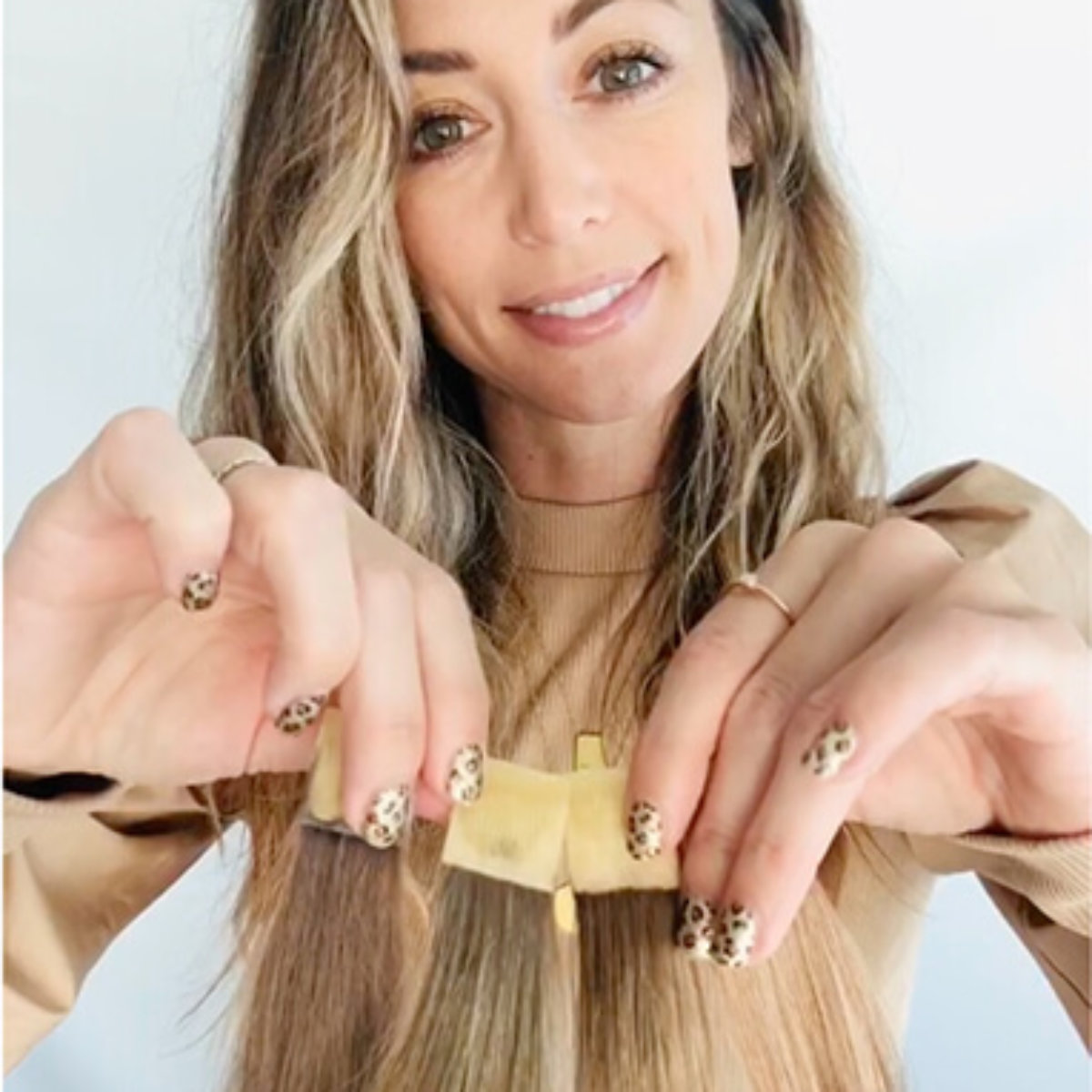 Hairstylist Jill Buck showing hair swatches in different colors