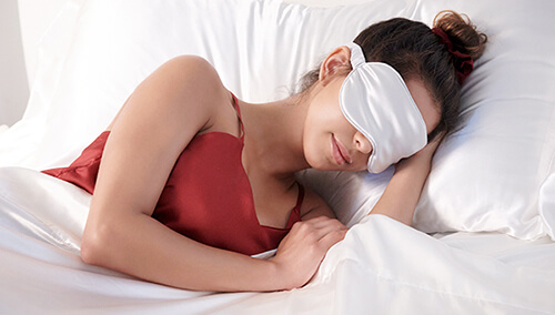 sleepover Woman sleeping with eye mask on