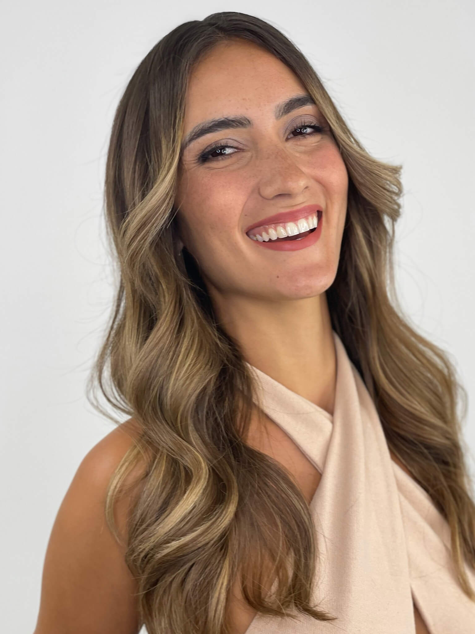 Cropped_Final_Look woman smiling with light brown curly hair