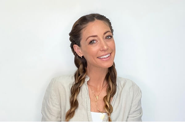 jill-beach-hair model with French braided hair smiling at camera