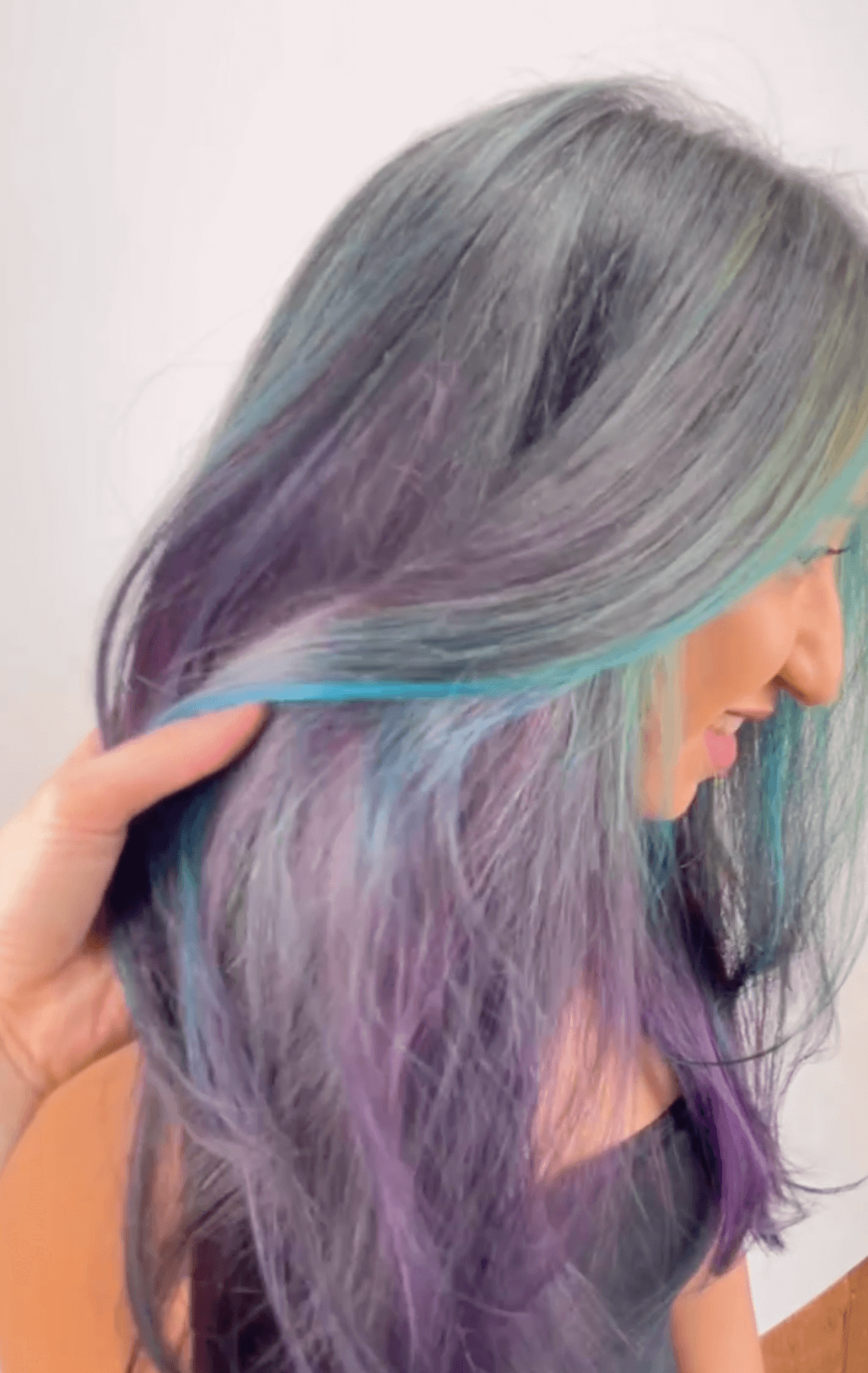 larisa-fall-lights-after woman showing off grey, purple and blue hair
