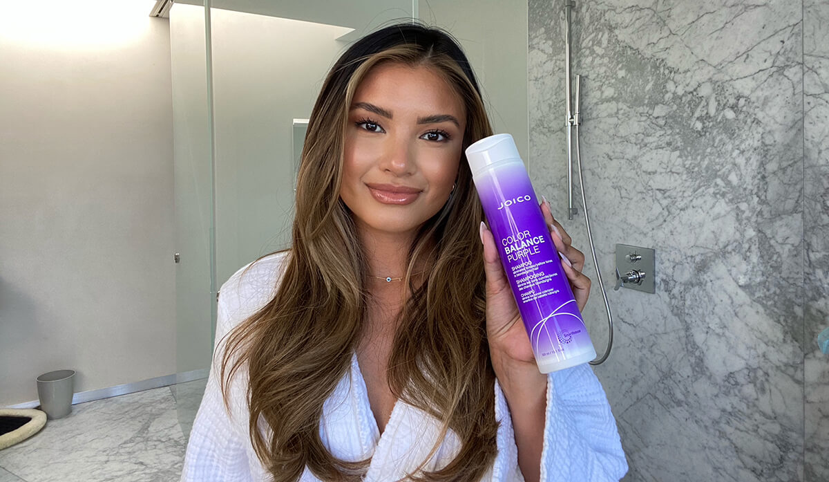pia-color-balance-purple Woman Holding Color balance purple shampoo