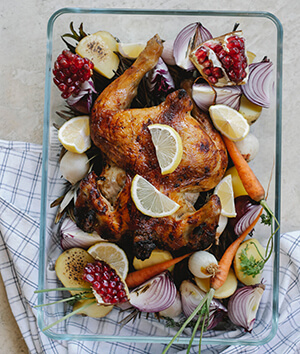 turkey Whole cooked turkey with lemons onions carrots and pomegrant