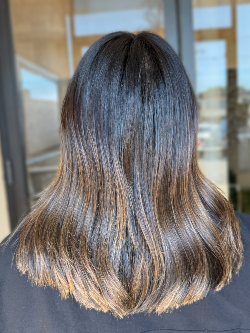 golden brown brunette hair model back of hair