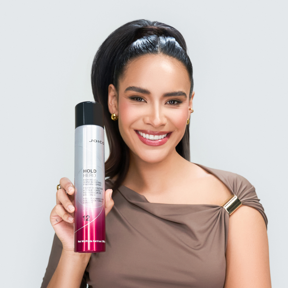 brunette model holding hold hero after treatment