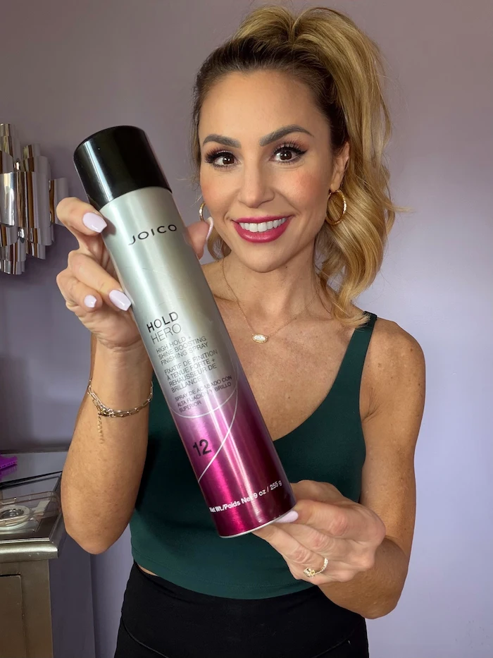 Vanessa Drozda with ponytail holding Hold Hero bottle