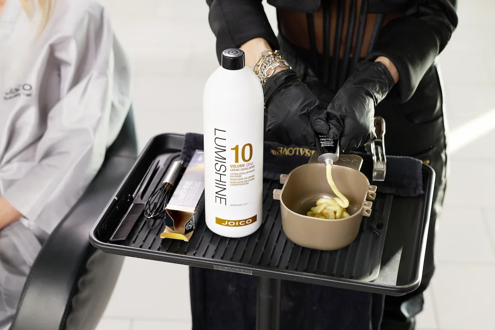 Joico Lumishine tube being dispensed in bowl