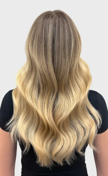 Woman with blonde wavy and highlighted hair