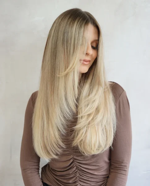 Woman smiling with long blonde hair